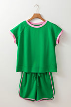 EG fashion green two tone tee and shorts set with pink trim on collar, sleeves, and shorts edges