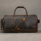 Men's brown leather gym bag with adjustable shoulder strap