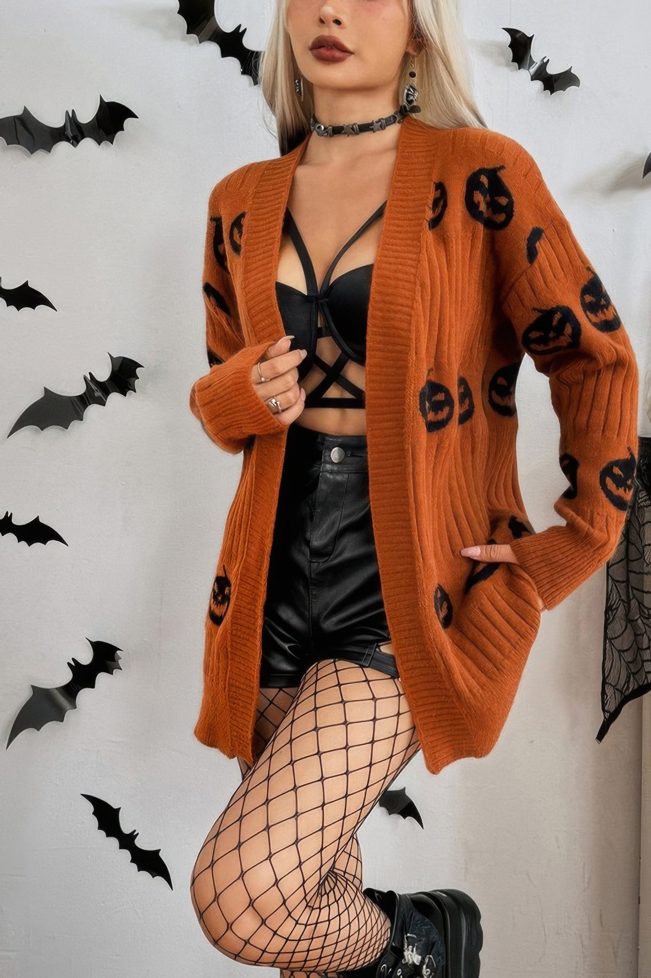 Cozy Halloween cardigan for women in orange with black pumpkin patterns, perfect for festive outfits