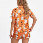 Halloween pajamas in orange, featuring ghost and pumpkin print, perfect for festive celebrations