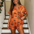 Women's orange Halloween pajamas with pumpkin print for festive sleeping