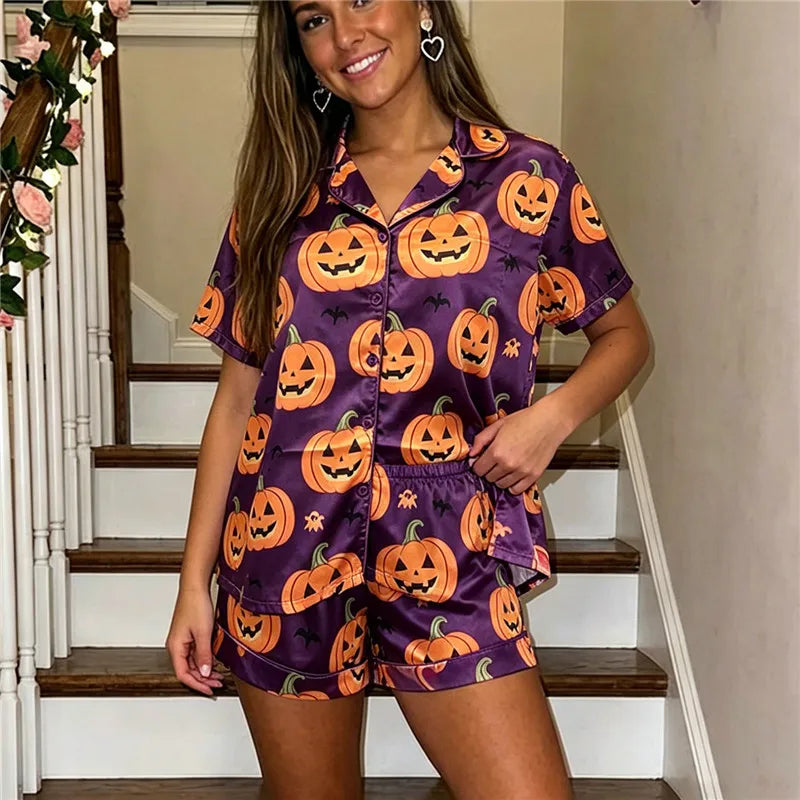 Women's purple Halloween pajamas featuring fun pumpkin prints