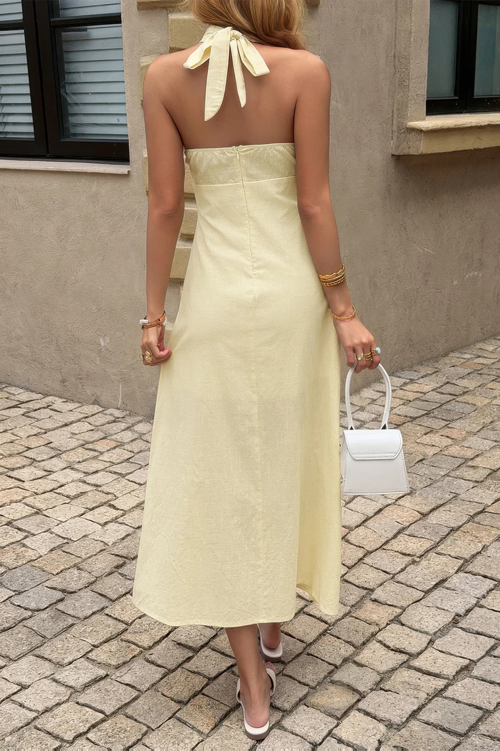 Women's yellow halter dress for summer outings, light fabric