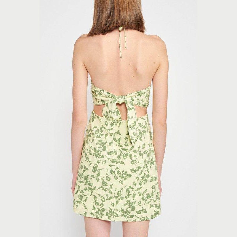 Back view of Emory Park halter neck floral mini dress with a tie design and leafy green pattern