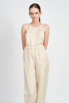 Emory Park halter neck jumpsuit open back in beige with a relaxed fit and elastic waistband