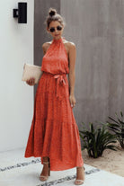VacationGrabs halter neck polka dot dress in orange with a flowy design and tie waist detail