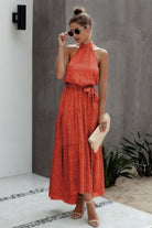 Stunning halter neck polka dot dress by VacationGrabs in vibrant red with a flowing skirt