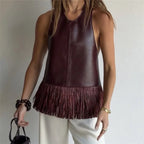 Women's burgundy leather halter-top with fringe details, stylish for casual outings