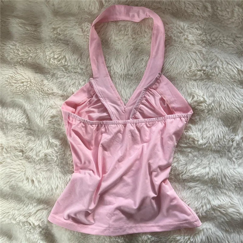Women's pink halter-top in soft fabric, perfect for summer wear