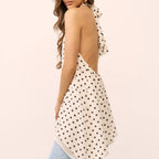 Women's polka dot halter-top in cream, perfect for summer outings