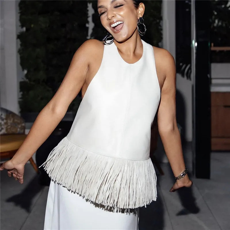 Women's white halter-top with fringe detailing, perfect for stylish summer outings
