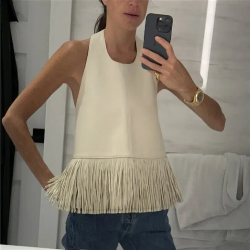 Women's cream halter-top with fringe detail, perfect for casual outings