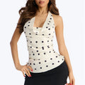Women's halter-top in cream with black polka dots, perfect for summer outings