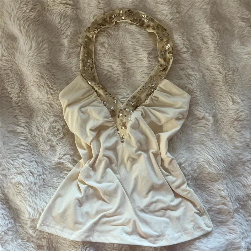 Women's cream halter-top with sequined neckline, perfect for summer outings