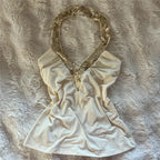 Women's cream halter-top with sequin neckline, perfect for summer outings