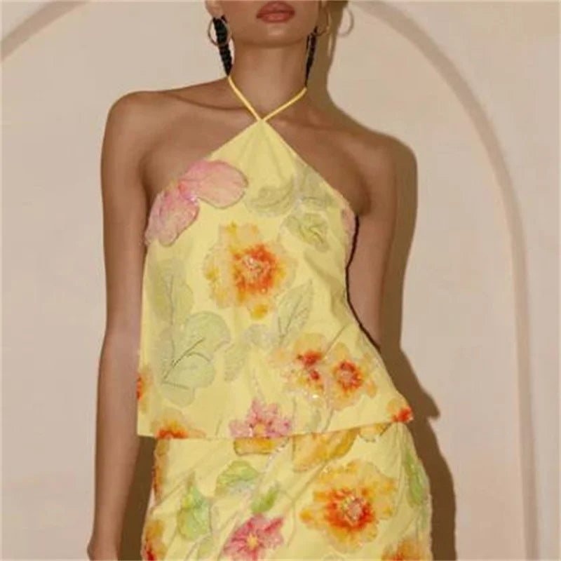 Women’s yellow floral halter top, lightweight fabric for summer outings