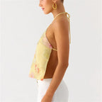 Women's yellow halter tops in floral design, perfect for beach outings
