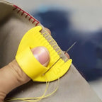 Hand-sewing needles for quick repairs with ergonomic yellow grip