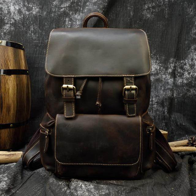 Handcrafted leather backpacks men women in dark brown with multiple pockets and adjustable straps