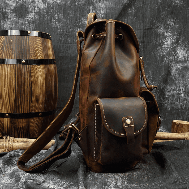 Handcrafted leather backpacks men women in dark brown with adjustable straps and front pocket