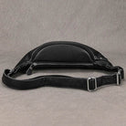 Stylish black hands-free leather fanny pack with sleek design and adjustable strap for convenient travel