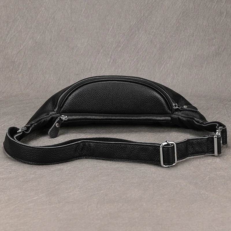Stylish black hands-free leather fanny pack with sleek design and adjustable strap for convenient travel