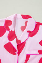 YNIQUE heart print valentine pajamas set with red heart patterns on pink fabric and button front