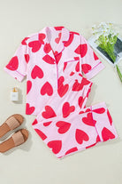 YNIQUE heart print valentine pajamas set with pink fabric and red hearts, short sleeve top and long pants