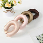 Heatless hair curlers for women in pink, gold, and brown satin