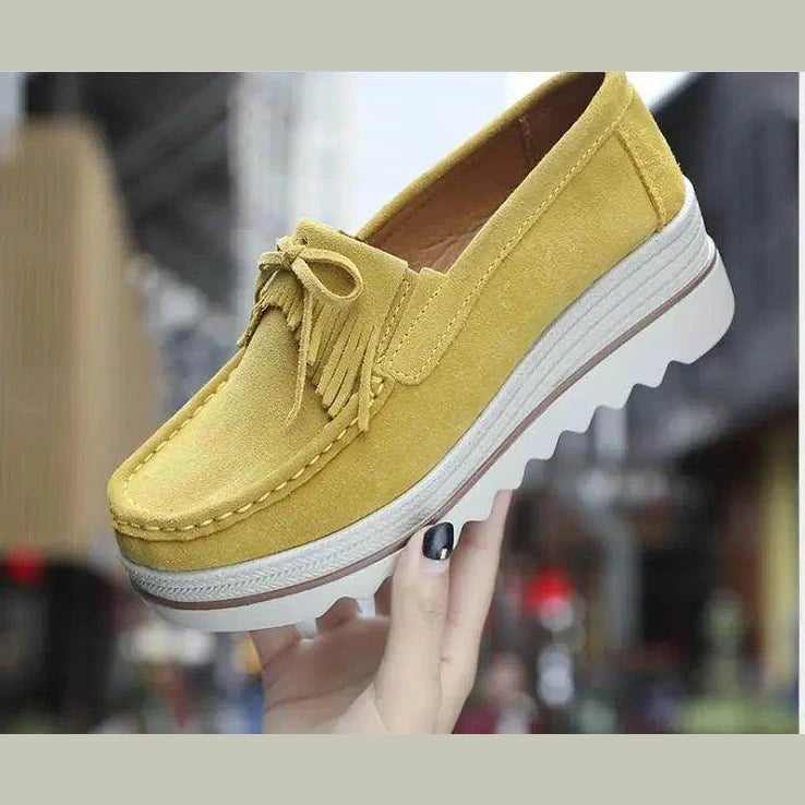 Women's yellow suede platform flats, perfect for casual outings