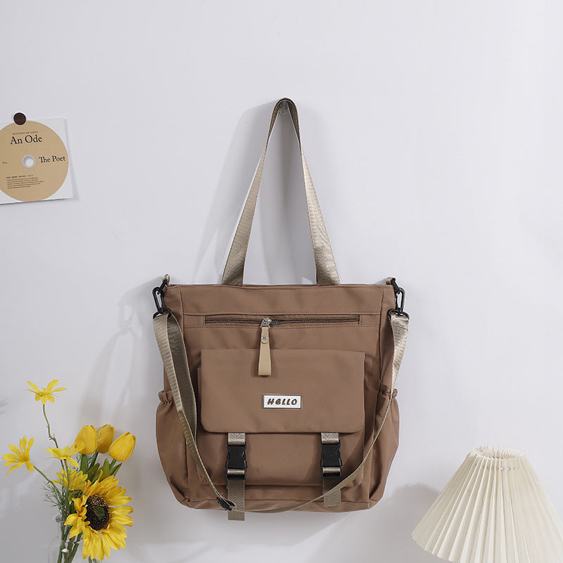 SHOMICOBOUTIQUE stylish large capacity tote bag in brown with adjustable straps and front zipper pocket