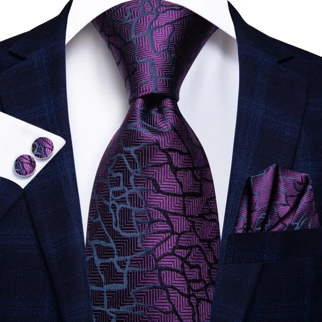 Men's blue tie collection with geometric patterns for formal events