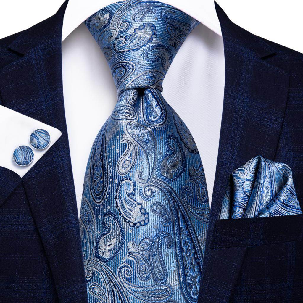 Gold paisley formal tie paired with a stylish suit, perfect for upscale events