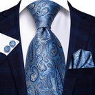 Gold paisley formal tie paired with a stylish suit, perfect for upscale events