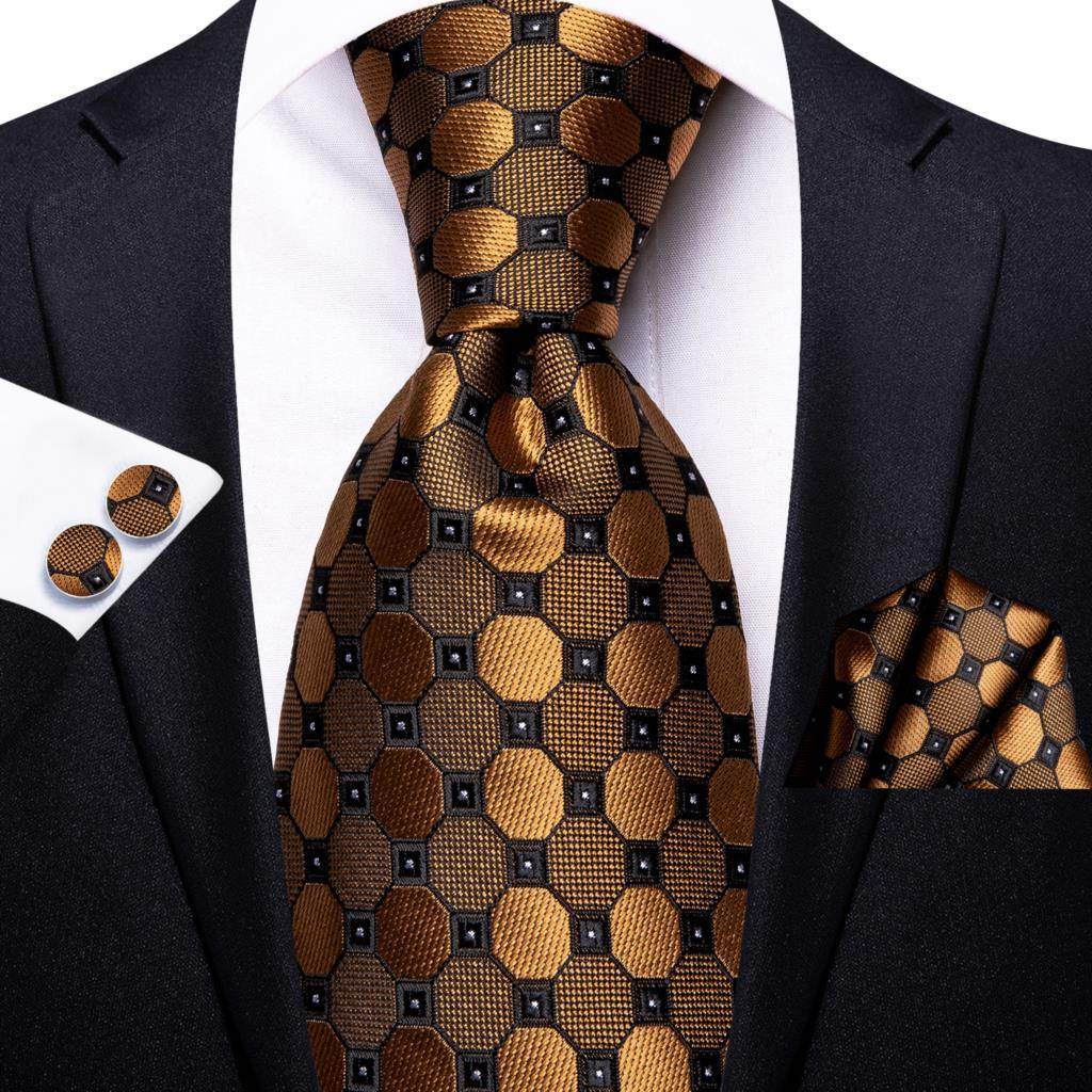 Stylish gold paisley formal tie paired with a matching pocket square and cufflinks for a sophisticated look
