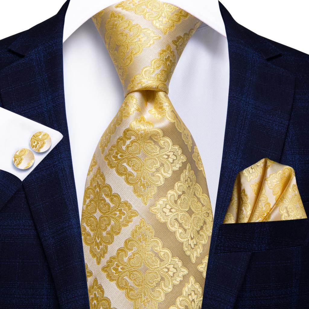 Elegant gold paisley formal tie paired with a matching pocket square for a sophisticated look