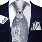 Elegant gold paisley formal tie paired with a dark suit for sophisticated style