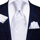 Gold paisley formal tie elegantly styled with a white dress shirt and navy suit, perfect for special occasions