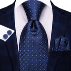 Navy patterned men's tie with matching pocket square and cufflinks for formal use
