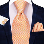 Orange patterned necktie how to tie with matching pocket square and cufflinks