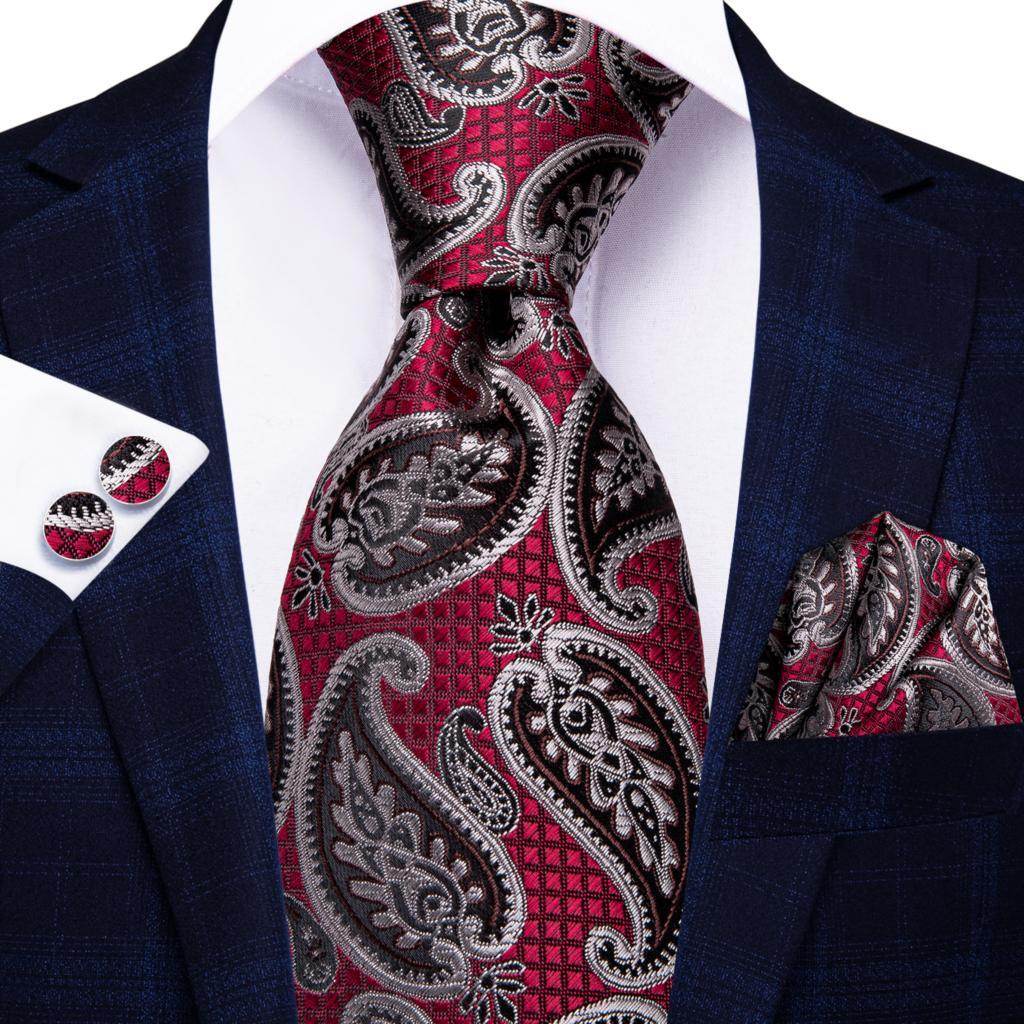 Elegant striped silk necktie in burgundy and silver paisley pattern with matching pocket square and cufflinks