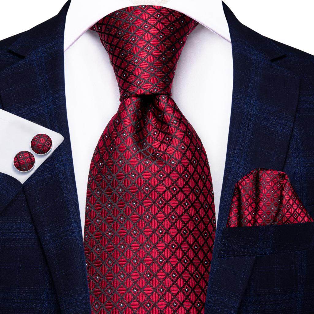 Elegant striped silk necktie in rich red tones paired with matching pocket square and cufflinks