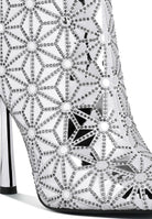 Stylish high ankle designer boots for women featuring a floral pattern and high heels