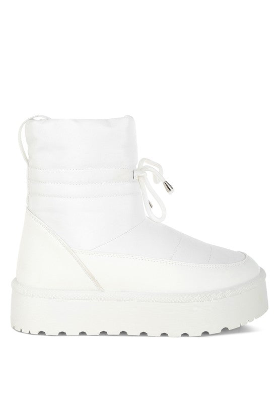 White women's high ankle winter boots featuring a sleek design and durable sole for comfort and style
