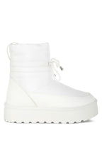 White women's high ankle winter boots featuring a sleek design and durable sole for comfort and style