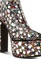 Rag Company high heel statement boots for women featuring colorful rhinestones and a bold design