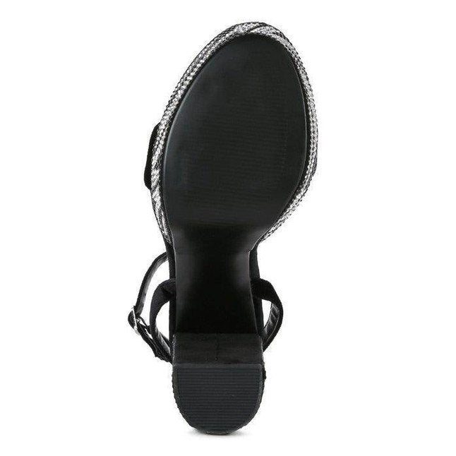 Sleek black high heel vacation sandals with stylish straps and a sturdy sole for summer outings