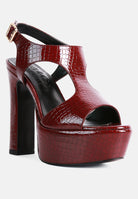 Stylish high heeled cut out sandals in red with a crocodile texture and chunky platform