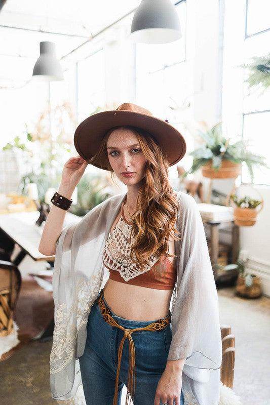 Leto Accessories high neck lace top styled with a brown hat and casual chic jeans