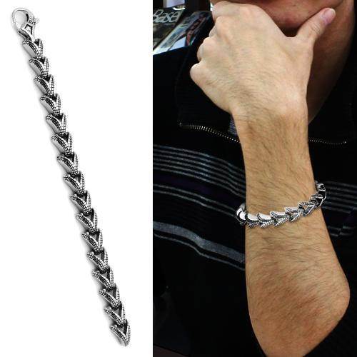 High polished men's bracelet featuring a sleek chain design worn on a wrist for stylish looks